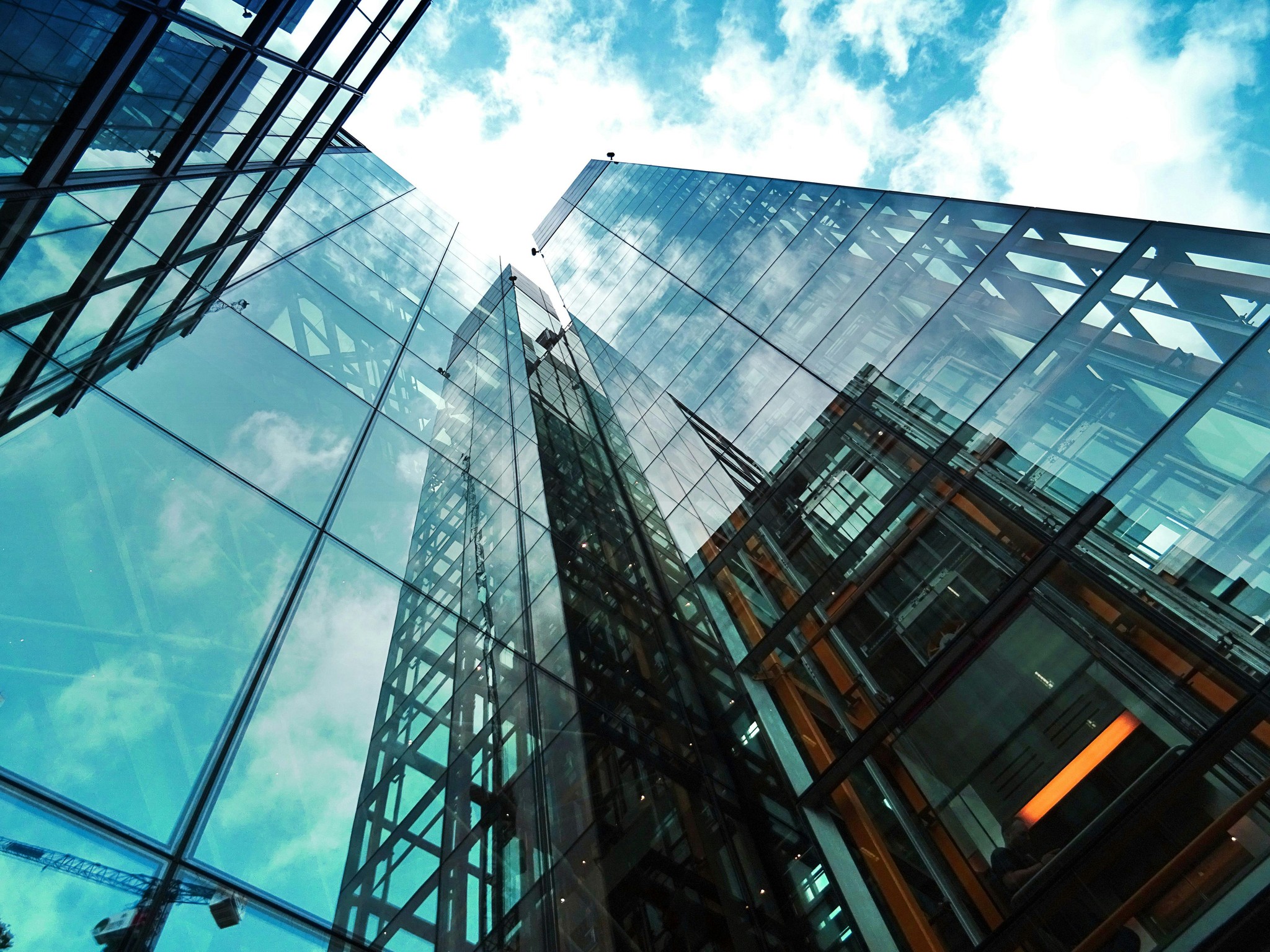 Glass buildings reflecting the sky